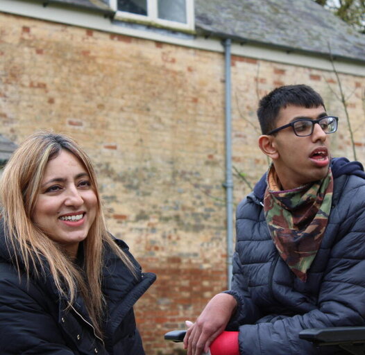 a women with her young son in a wheelchair