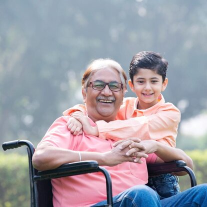 man in wheelchair with son